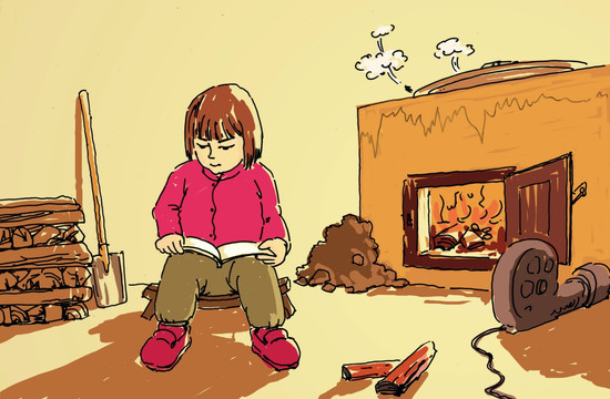 在炉灶前读书的小女孩
