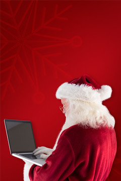 圣诞老人拿着电脑的复合形象