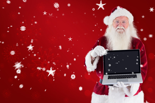 圣诞老人拿着电脑的复合形象
