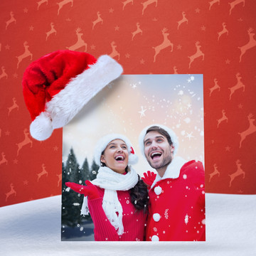 夫妇穿着圣诞装微笑着的复合形象