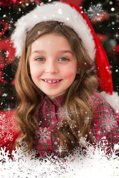 小女孩戴着圣诞帽微笑的复合形象