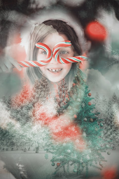 圣诞节拿着拐杖糖的小女孩