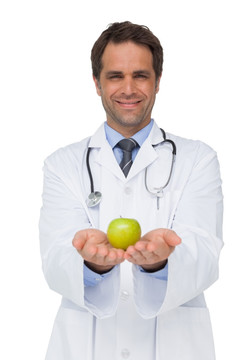 微笑着拿着苹果的医生