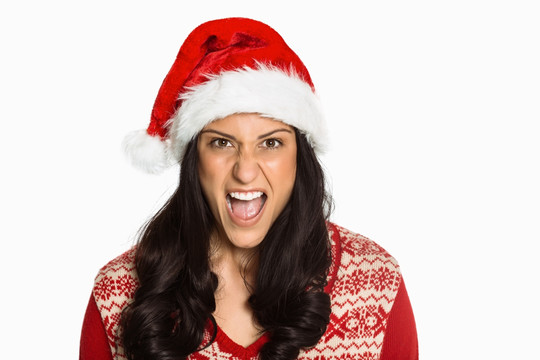 戴着圣诞帽愤怒的年轻女人