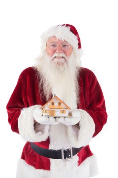 拿着房屋模型的圣诞老人
