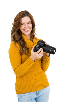微笑的女人拿着相机