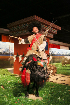 骑牦牛的西藏青年蜡像