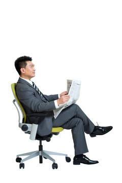 棚拍商务男士坐办公椅看报纸