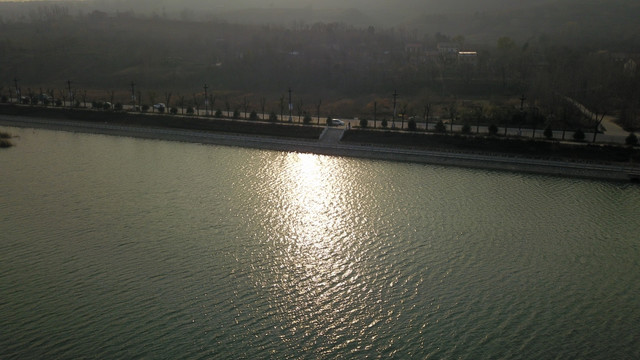 航拍滨河生态湿地公园夕阳