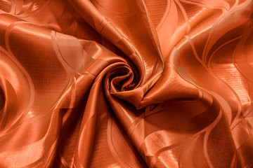 橘红色暗纹丝绸质地化纤窗帘布背