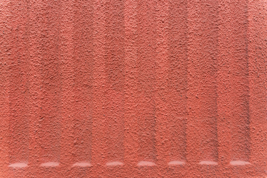红色凹凸水泥墙纹理