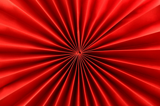红色折纸放射图案纹理背景