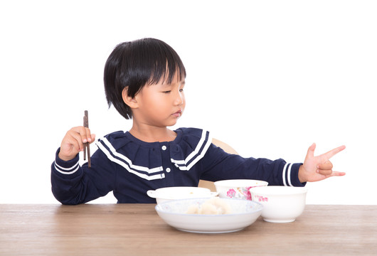 吃着饭连带卖萌的中国小女孩