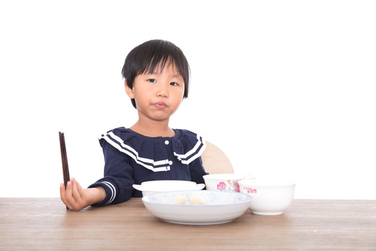 吃着饭连带卖萌的中国小女孩