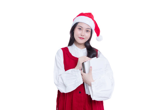 圣诞帽的女学生怀抱着书本