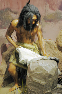 原始人制作兽皮衣服