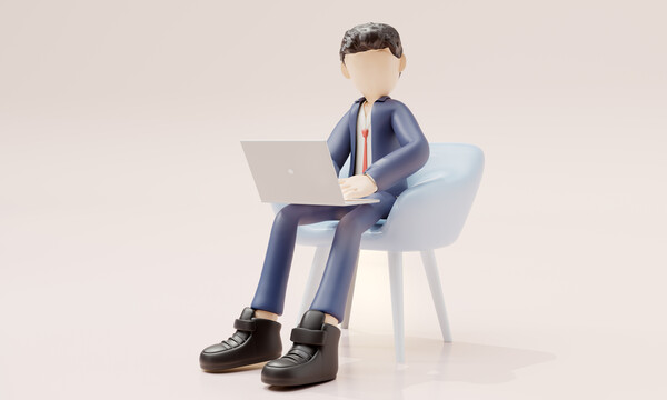 商務(wù)男在沙發(fā)上使用筆記本電腦