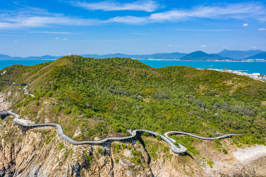 航拍三亚西岛海边山崖壁岩石