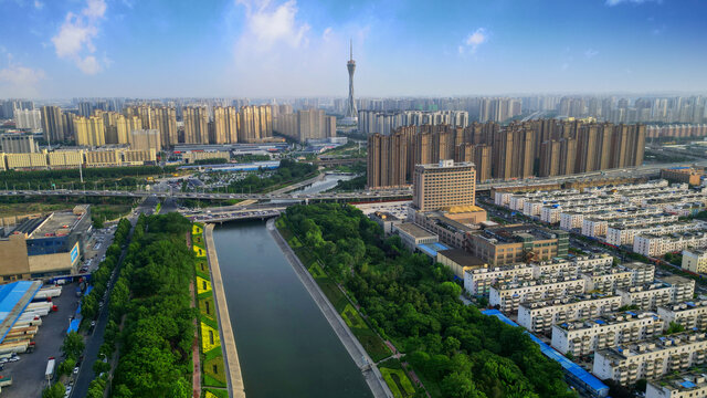 蓝天白云城市河边中原福塔