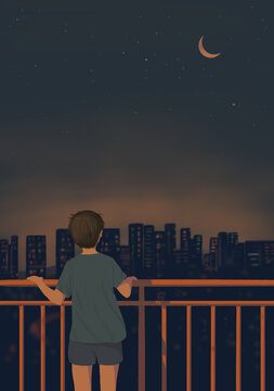 男孩站在陽臺看城市夜色