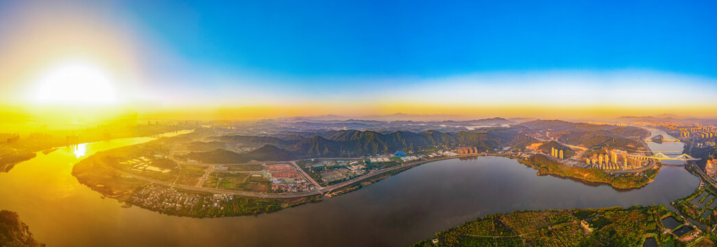 惠州城市河流夕阳航拍图