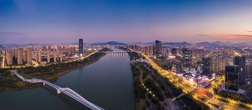 落日余晖下的上虞城市夜景航拍