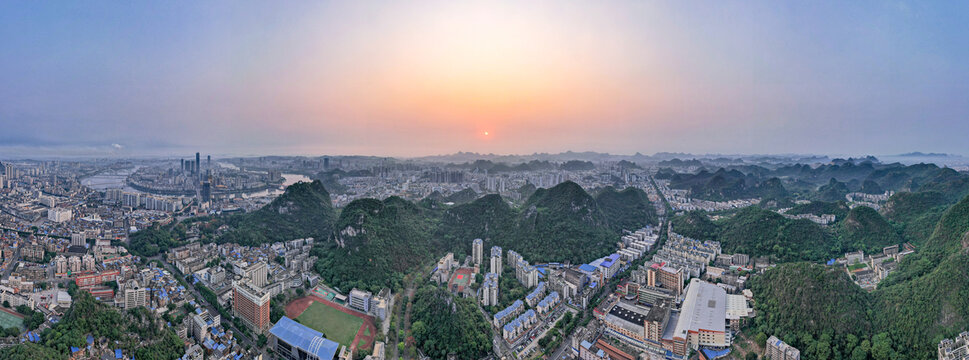 广西柳州城市清晨日出航拍全景图