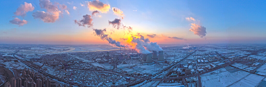 航拍雪天夕陽發電廠全景