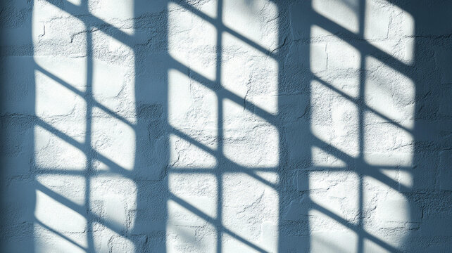 淺灰色磚墻上窗影