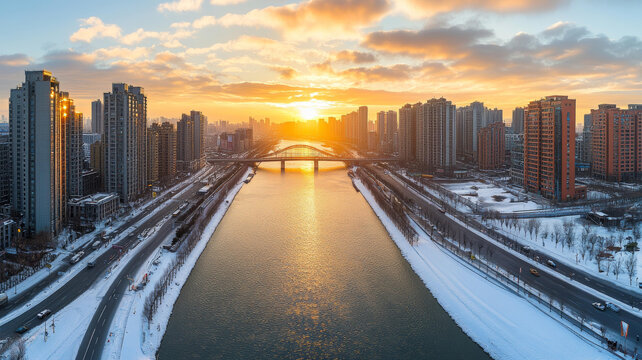 清晨的雪景城市河畔日出