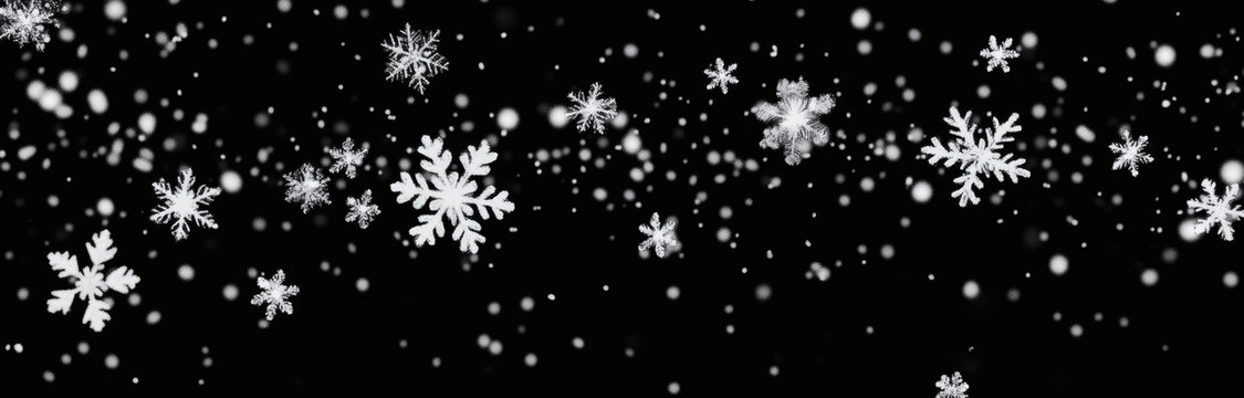 黑色背景上的飄落雪花
