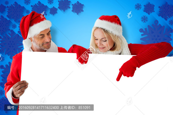 夫婦戴著圣誕帽微笑的復(fù)合形象