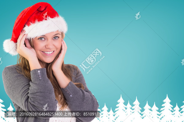 女人戴著圣誕帽微笑的復合形象