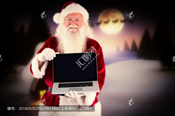 圣誕老人拿著筆記本的復(fù)合形象