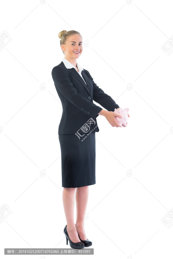 女商人抱着小猪储蓄罐