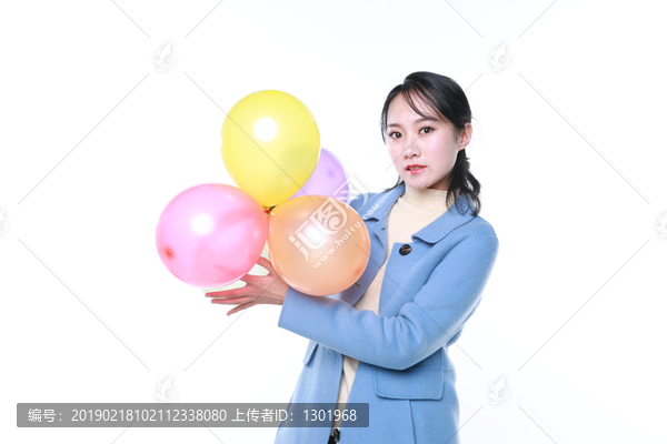拿气球的年轻女性素材图片