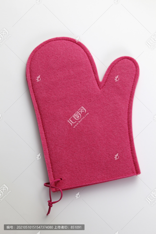 粉红色厨房手套的库存图片