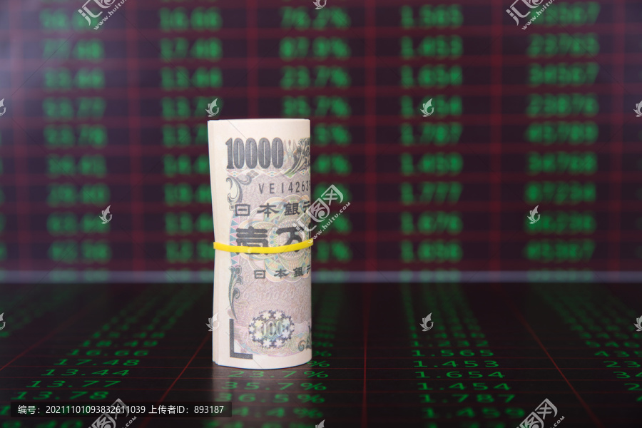 经济数字背景上一卷日元钞票