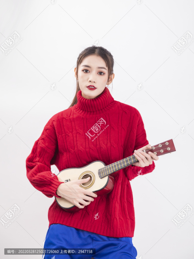 穿著紅色毛衣的年輕女性-匯圖網(wǎng) fosd68.com 穿著紅色毛衣的年輕女性