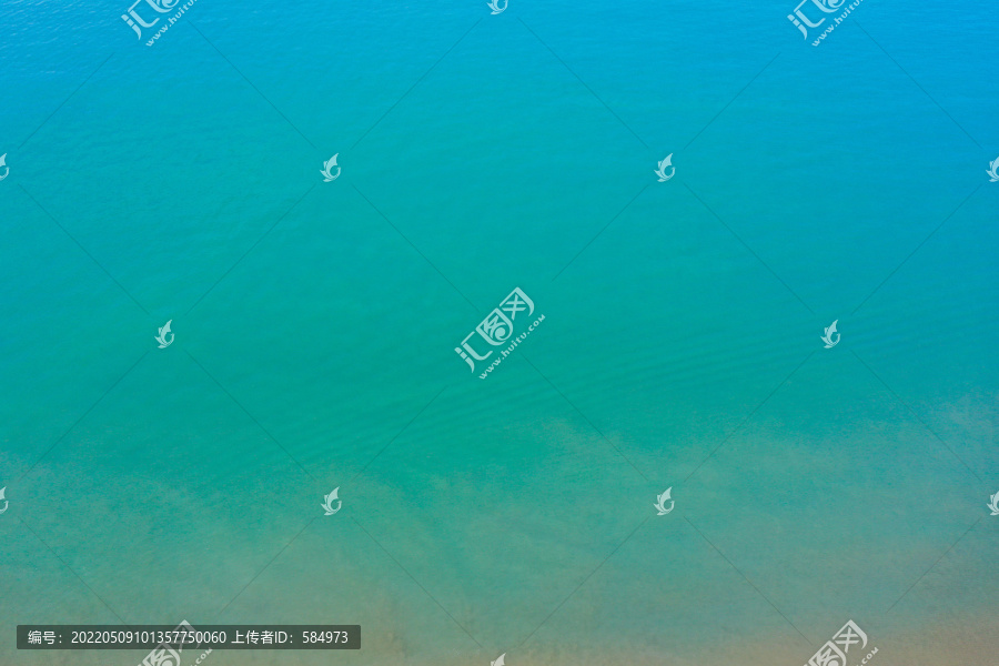 航拍海南三亚湾蓝色海面