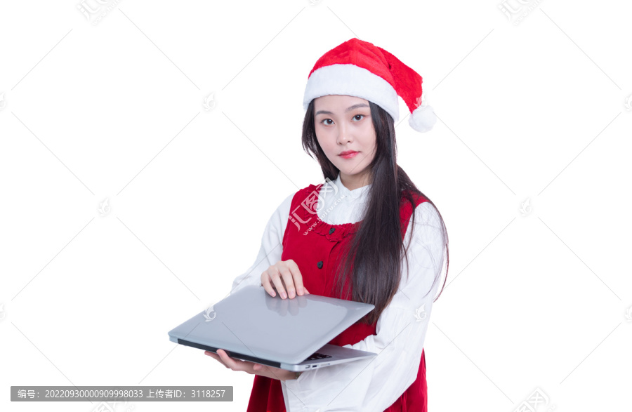 圣诞节女孩手持笔记本电脑