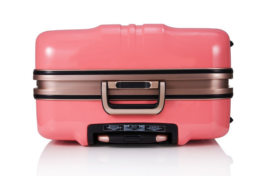 平放的粉色行李箱