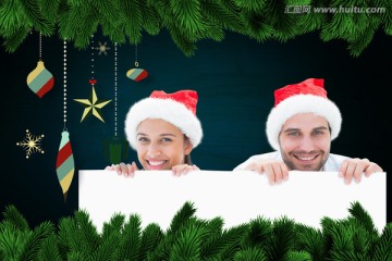 夫妇戴着圣诞帽微笑着的复合形象