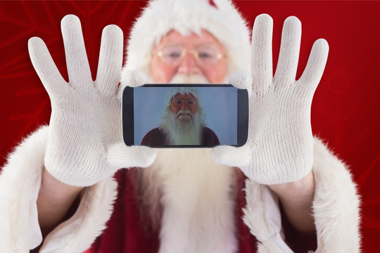 圣诞老人展示手机的复合形象