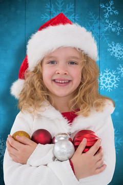 圣诞节小女孩抱着圣诞装饰品