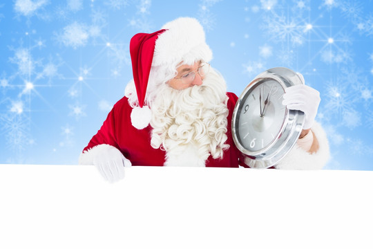 圣诞老人手拿着钟的复合形象