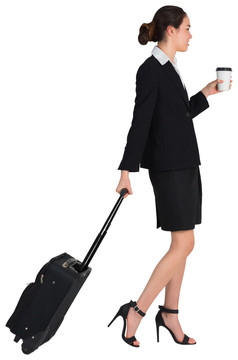 商人拿着咖啡拉她的手提箱