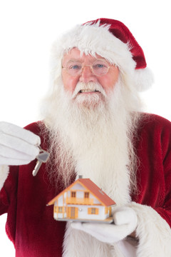 拿着房屋模型的圣诞老人