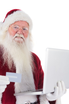 拿着笔记本电脑的圣诞老人