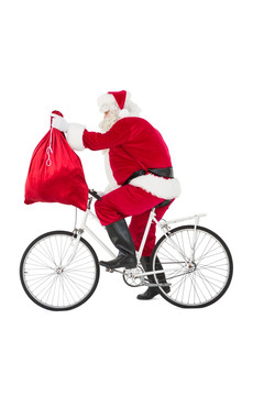 带着一袋礼物骑自行车的圣诞老人